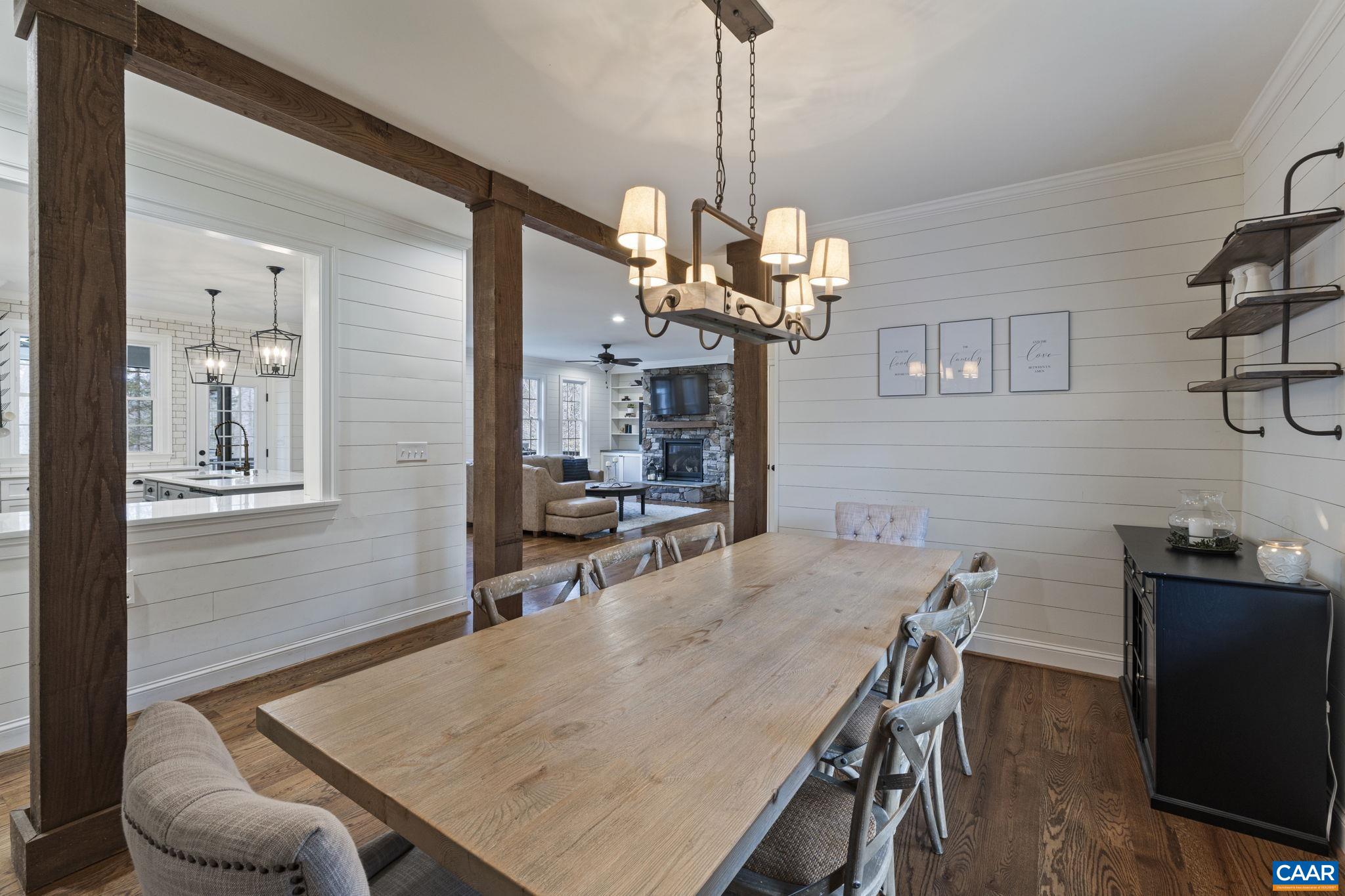 269 Devon Drive Ruckersville, VA 22968 - Photo 22 of 51 a view of a dining room with furniture a chandelier and wooden floor