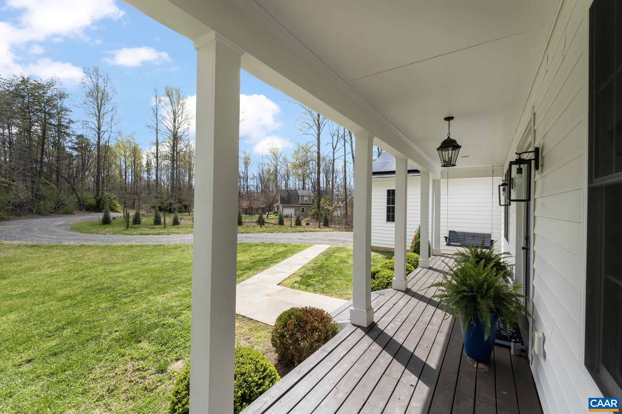 269 Devon Drive Ruckersville, VA 22968 - Photo 3 of 51 a view of balcony with a floor to ceiling window and wooden floor