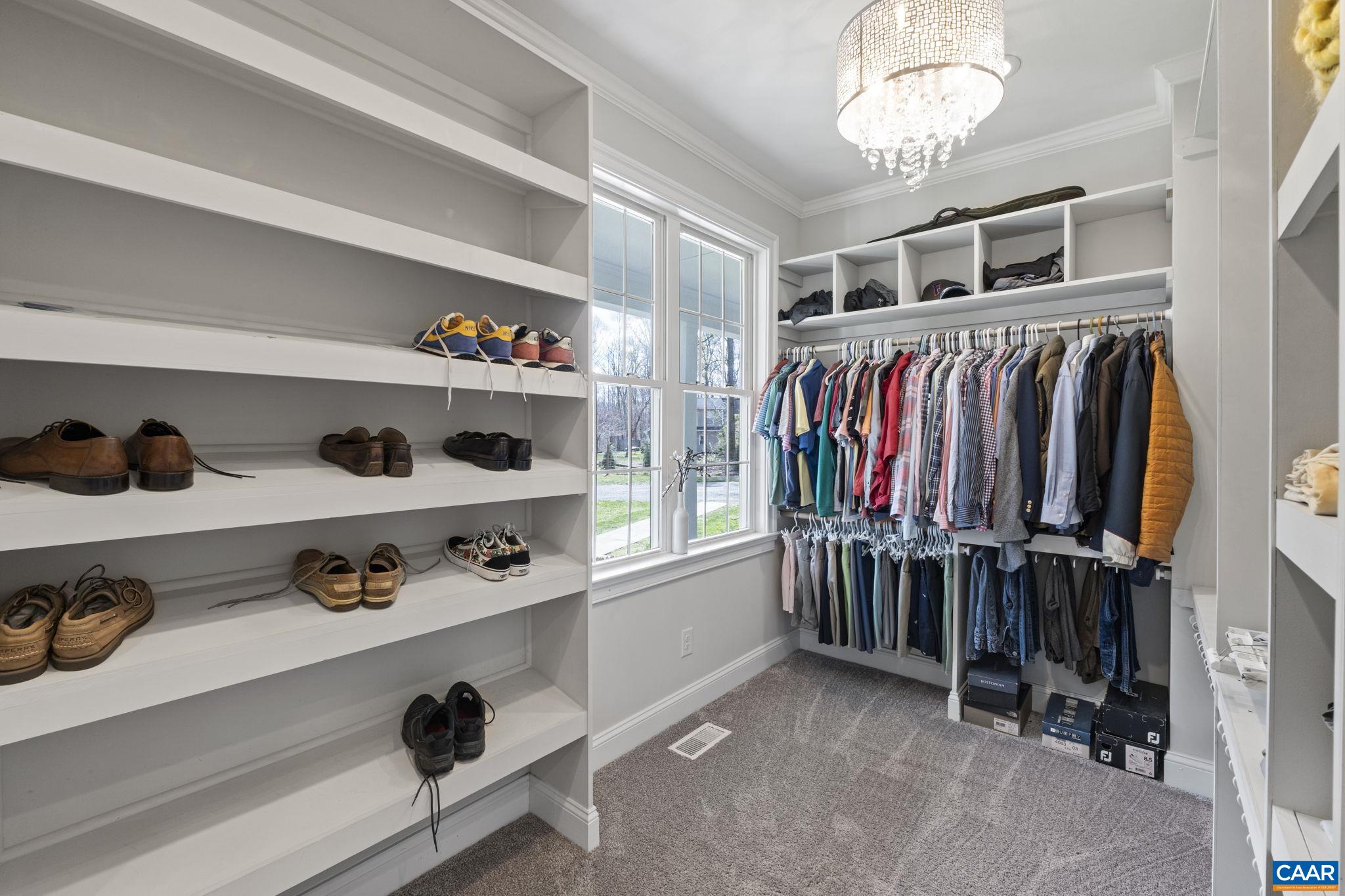 269 Devon Drive Ruckersville, VA 22968 - Photo 32 of 51 a view of walk in closet with clothes and shoes