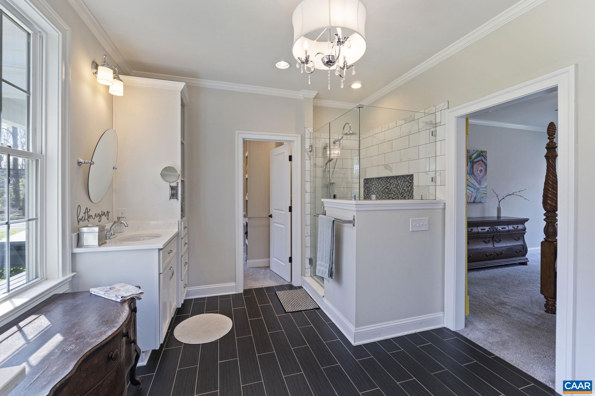 269 Devon Drive Ruckersville, VA 22968 - Photo 33 of 51 a spacious bathroom with a sink shower and a mirror