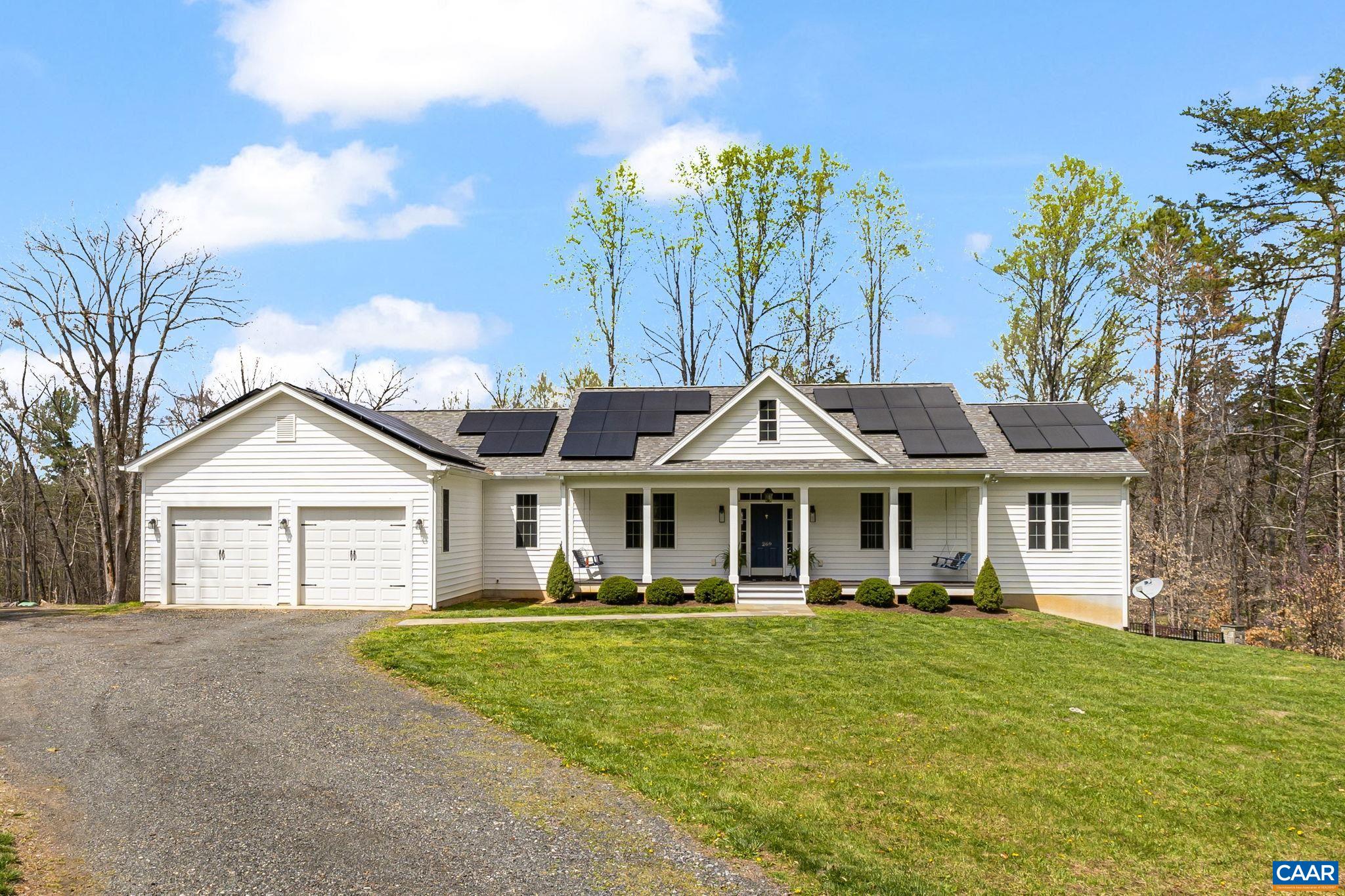 269 Devon Drive Ruckersville, VA 22968 - Photo 4 of 51 a front view of a house with a yard