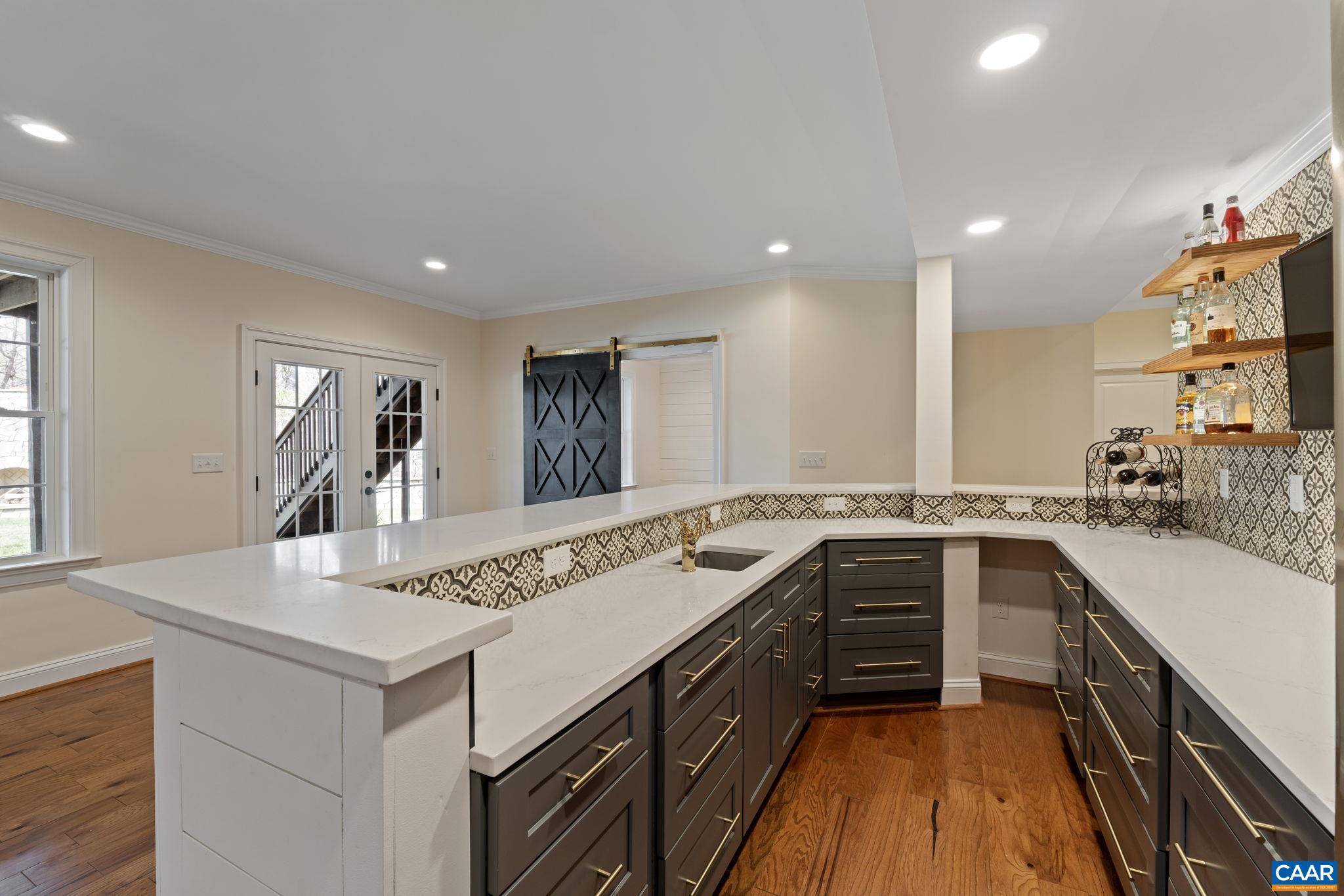 269 Devon Drive Ruckersville, VA 22968 - Photo 41 of 51 a kitchen with a sink stove and cabinets