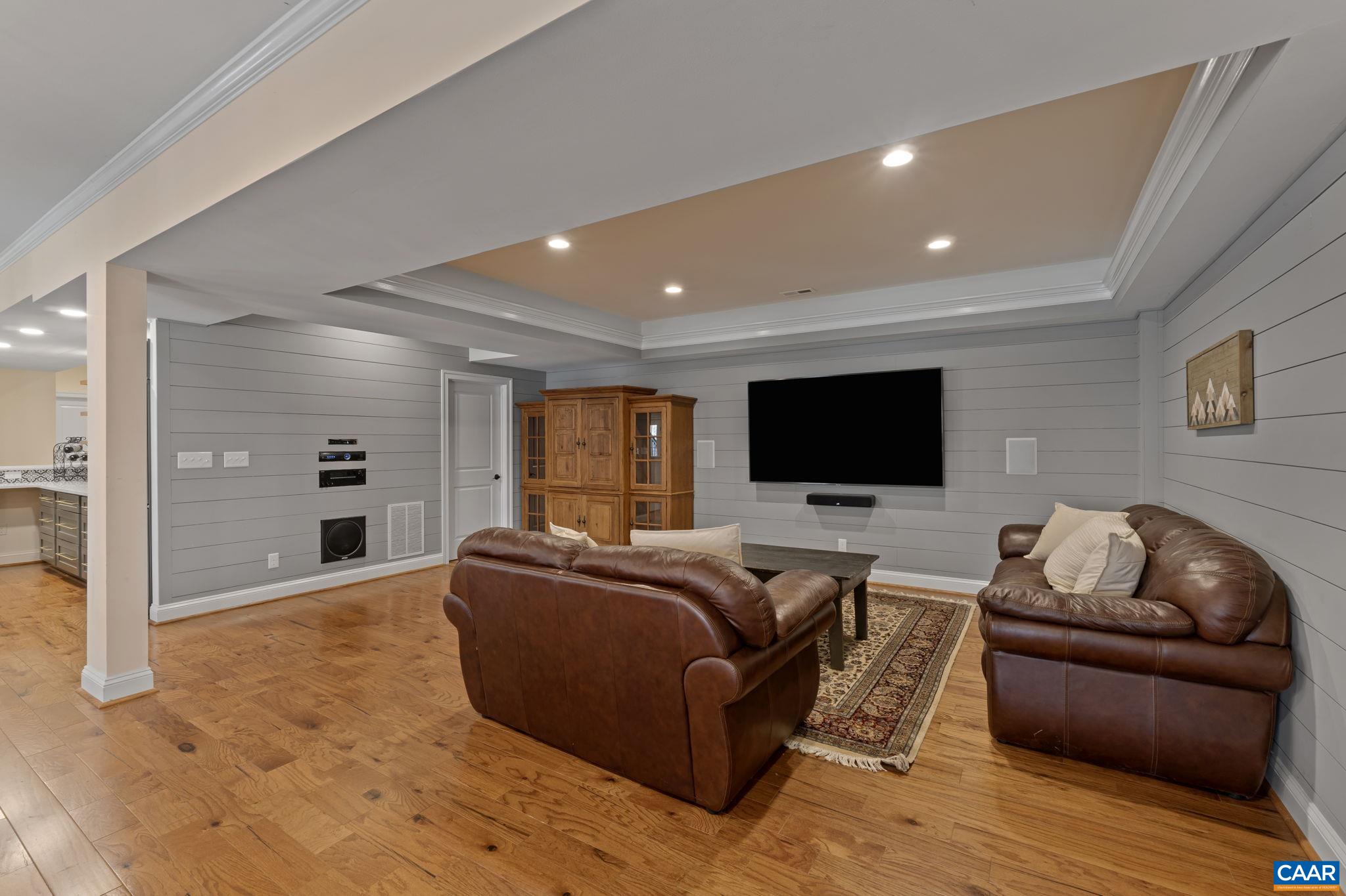 269 Devon Drive Ruckersville, VA 22968 - Photo 43 of 51 a living room with furniture and a flat screen tv