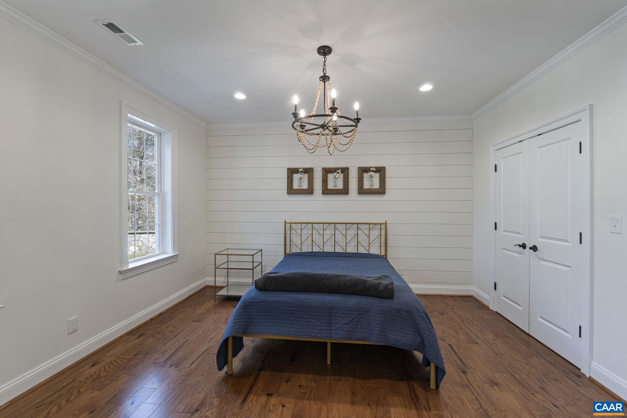 269 Devon Drive Ruckersville, VA 22968 - Photo 44 of 51 a bed room with a bed mirror and a window