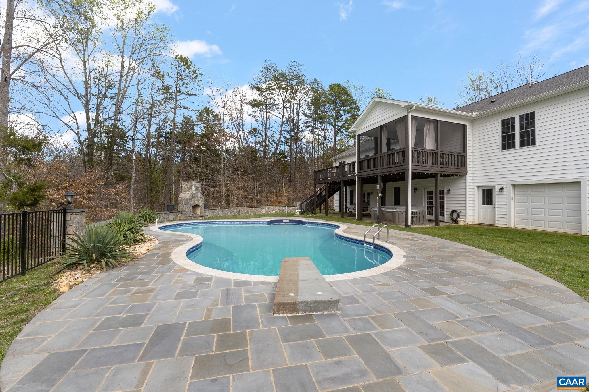 269 Devon Drive Ruckersville, VA 22968 - Photo 48 of 51 a view of a swimming pool with a patio