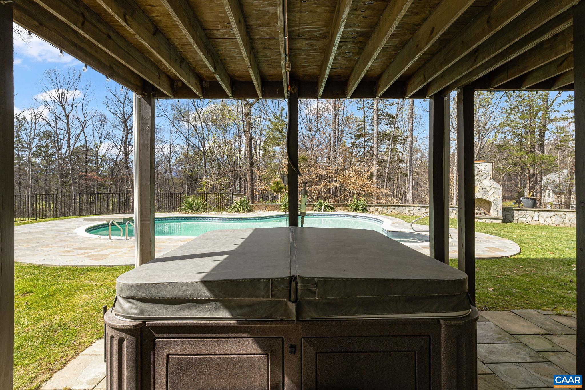 269 Devon Drive Ruckersville, VA 22968 - Photo 49 of 51 a patio with table and chairs