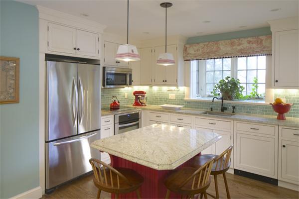 6 Upland Road West Arlington, MA 02474 - Photo 5 of 9 a kitchen with granite countertop a refrigerator a sink a stove and chairs