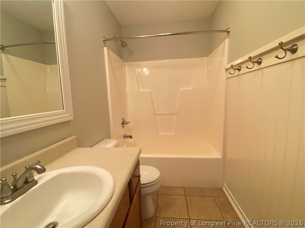 58 Polk Street Spring Lake, NC 28390 - Photo 20 of 26 a bathroom with a sink and a shower