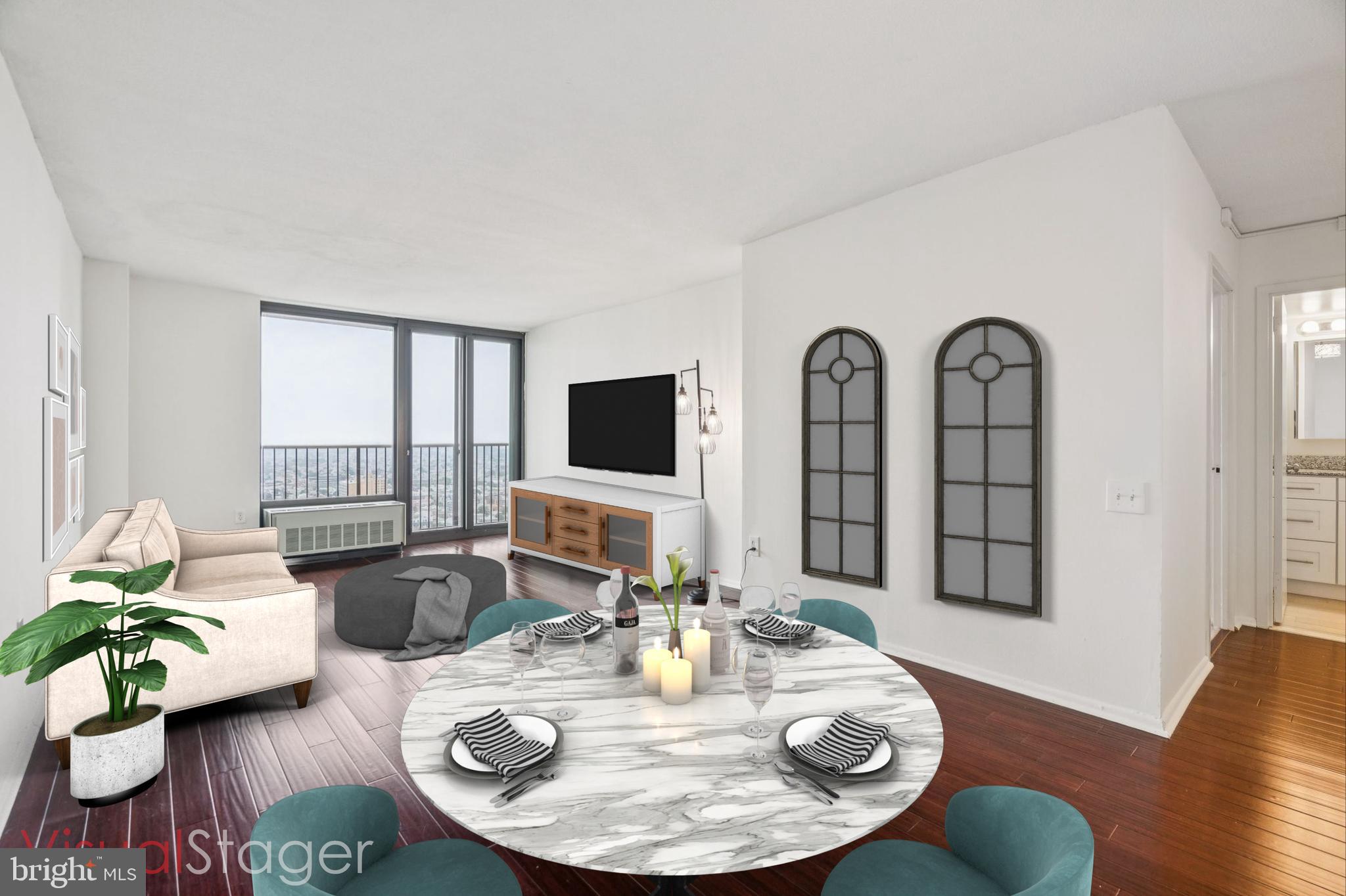 a living room with furniture and wooden floor