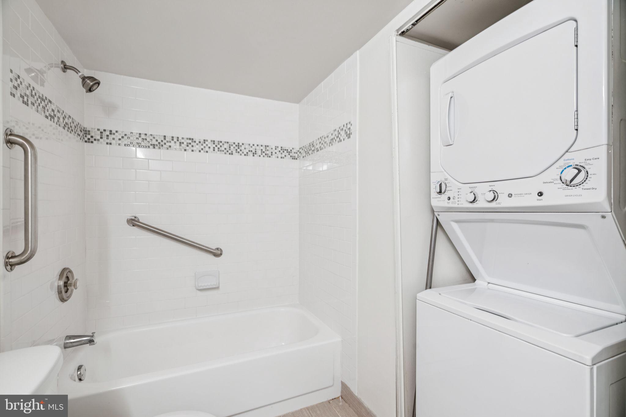 1420 Locust Street, Unit 28P Philadelphia, PA 19102 - Photo 13 of 25 a bathroom with a sink a mirror and a bathtub