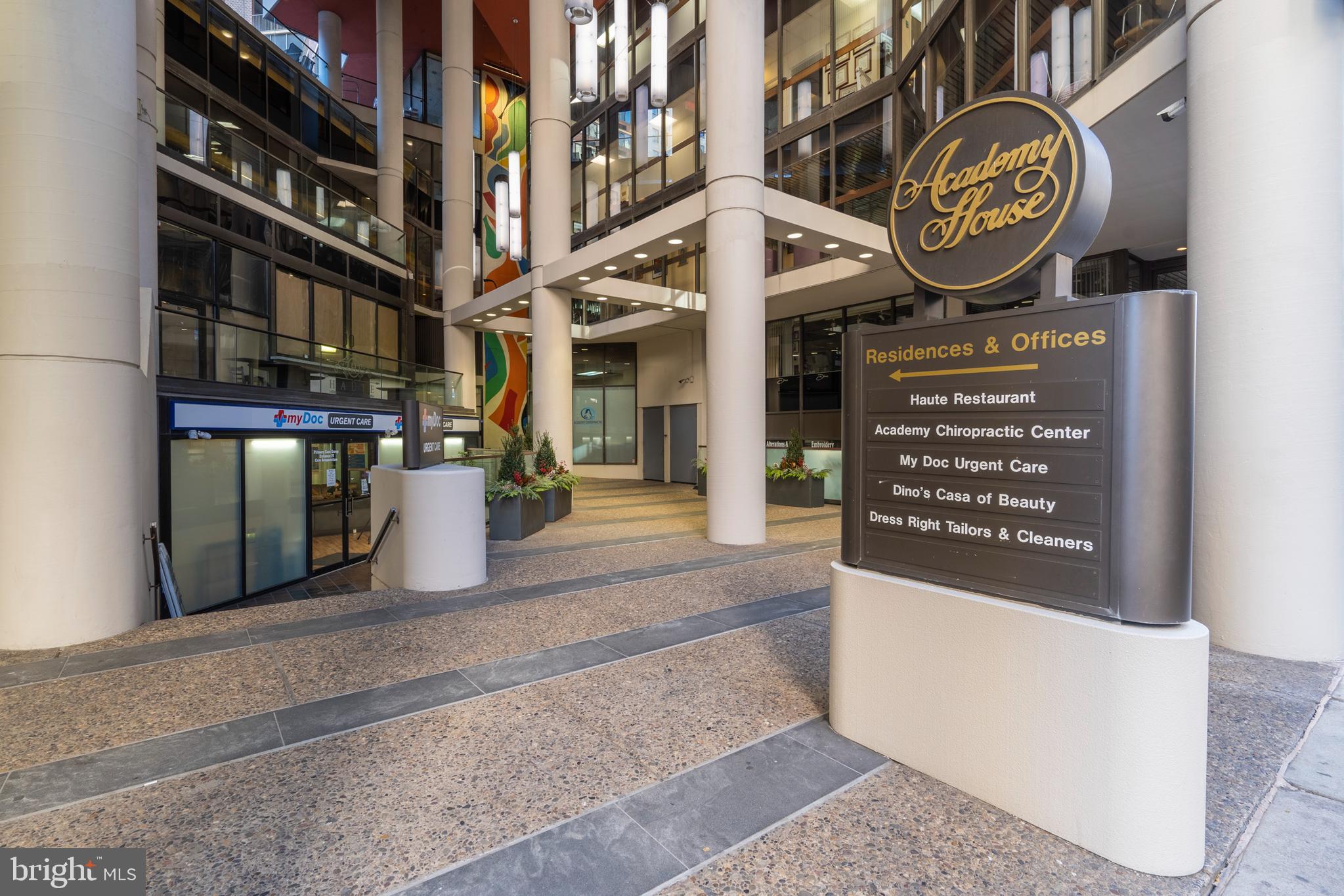 1420 Locust Street, Unit 28P Philadelphia, PA 19102 - Photo 24 of 25 a view of a sign board with a building in the background