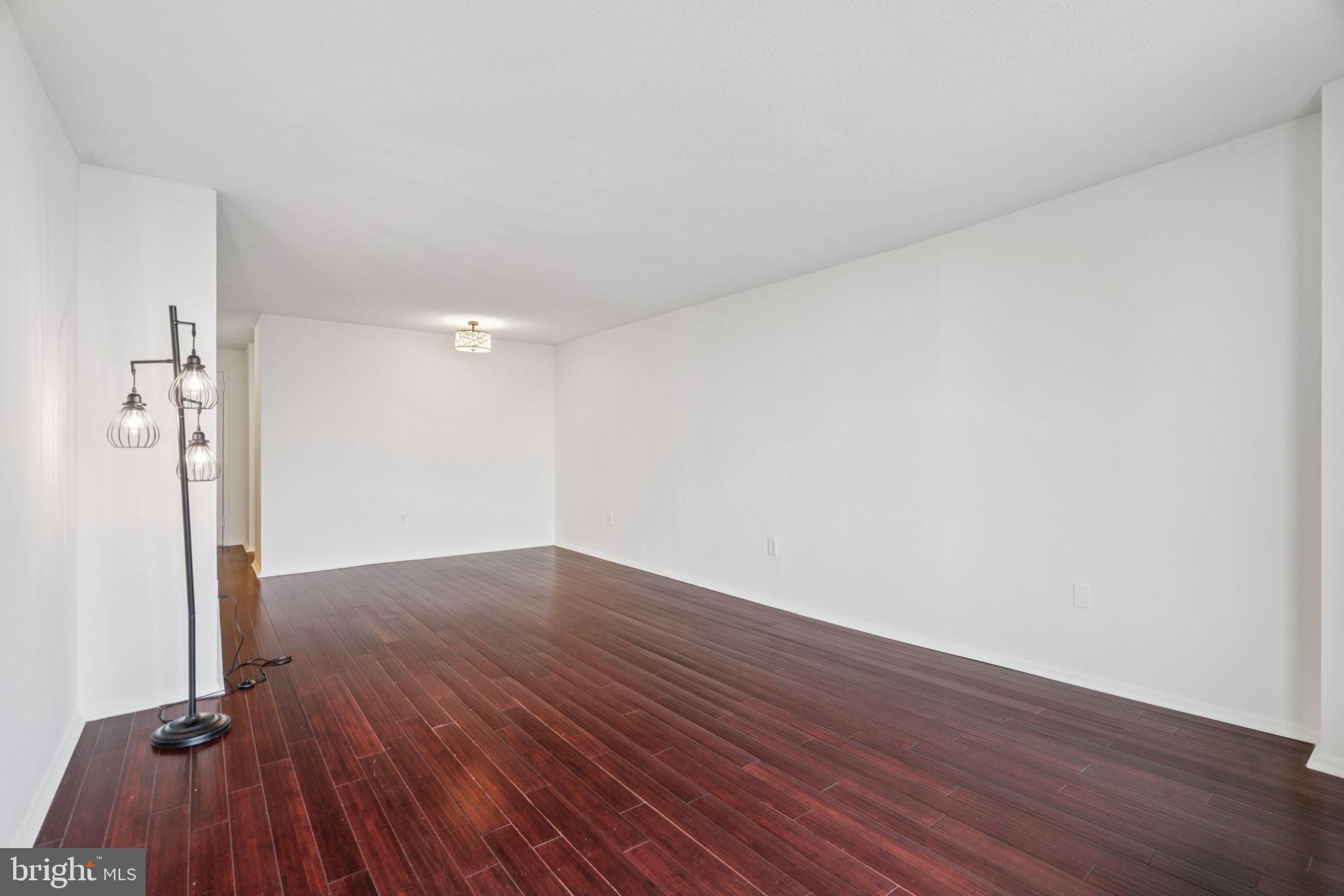 1420 Locust Street, Unit 28P Philadelphia, PA 19102 - Photo 5 of 25 a view of a room with wooden floor and a sink