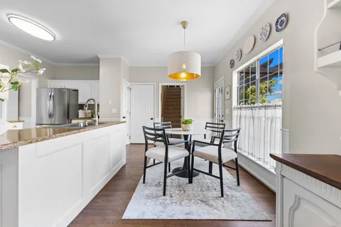 a spacious bedroom with a bed and a window