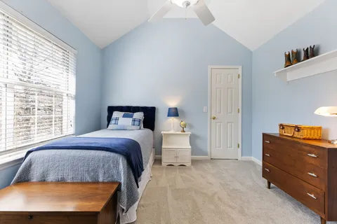 a bed room with furniture and a chandelier