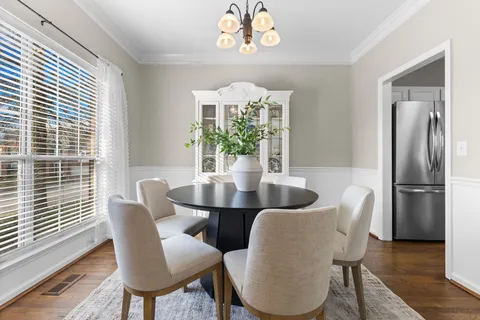 a bedroom with furniture and a wooden floor