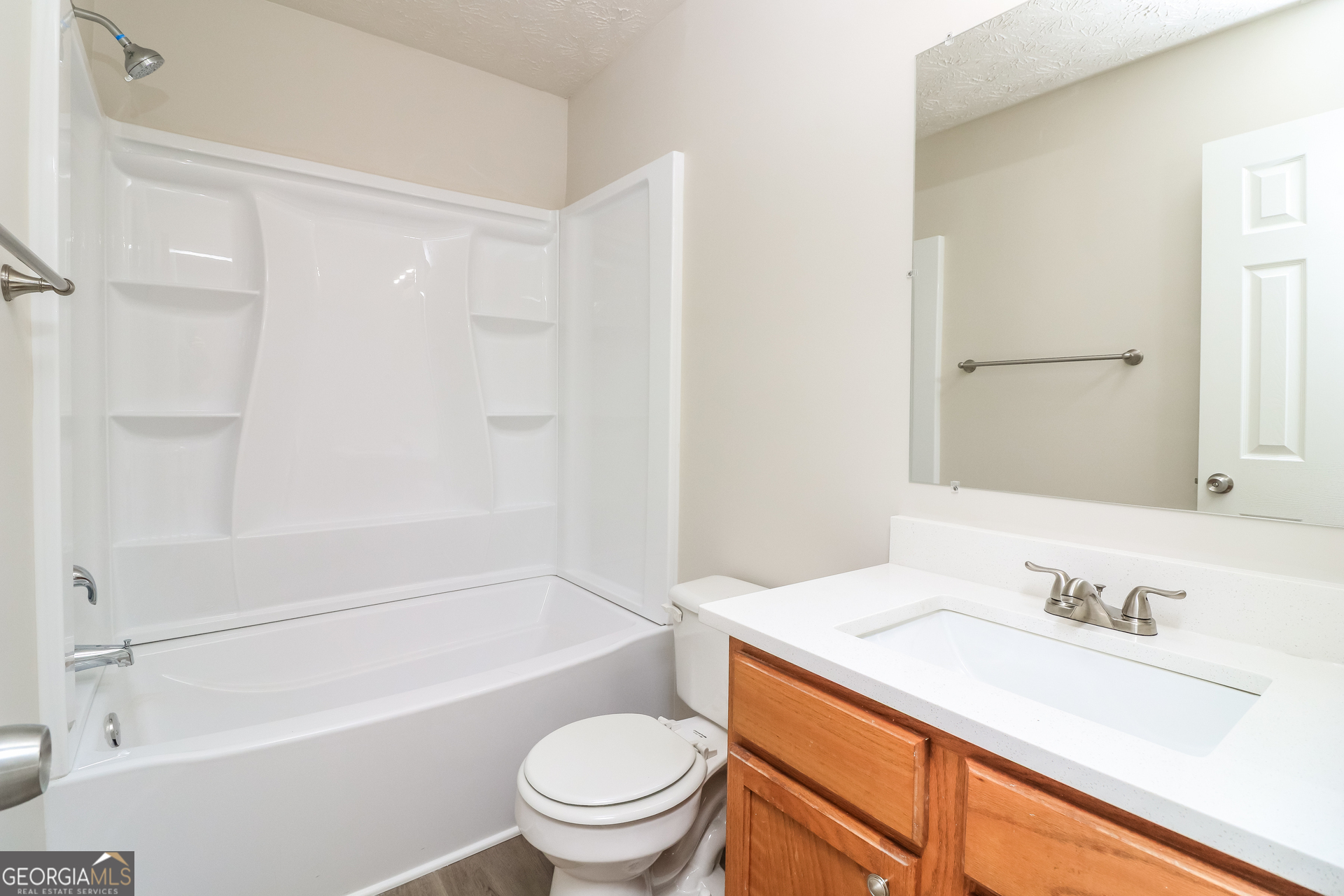 3623 Thurleston Court Southwest Austell, GA 30106 - Photo 14 of 17 a bathroom with a granite countertop sink toilet and shower