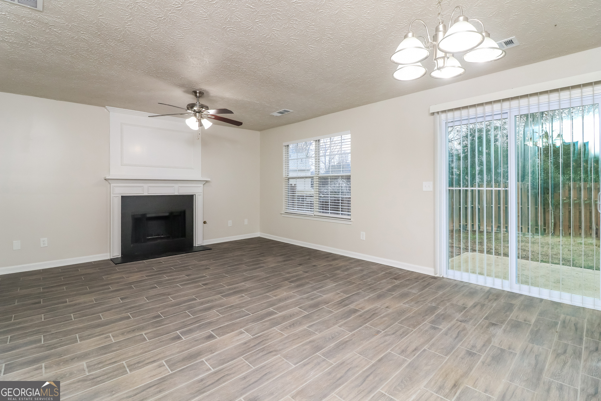 3623 Thurleston Court Southwest Austell, GA 30106 - Photo 6 of 17 a view of empty room with wooden floor and fan