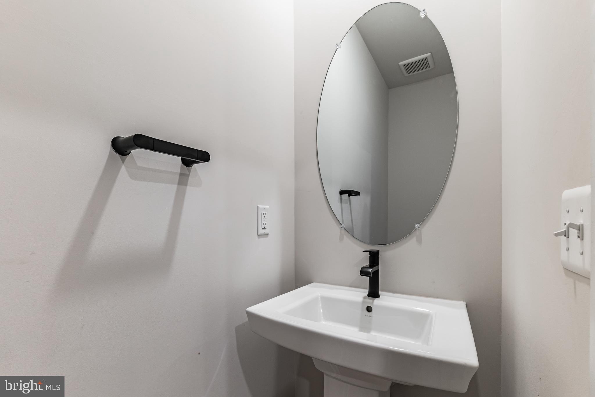 4404 Roland Heights Avenue Baltimore, MD 21211 - Photo 17 of 36 Half Bath on main level