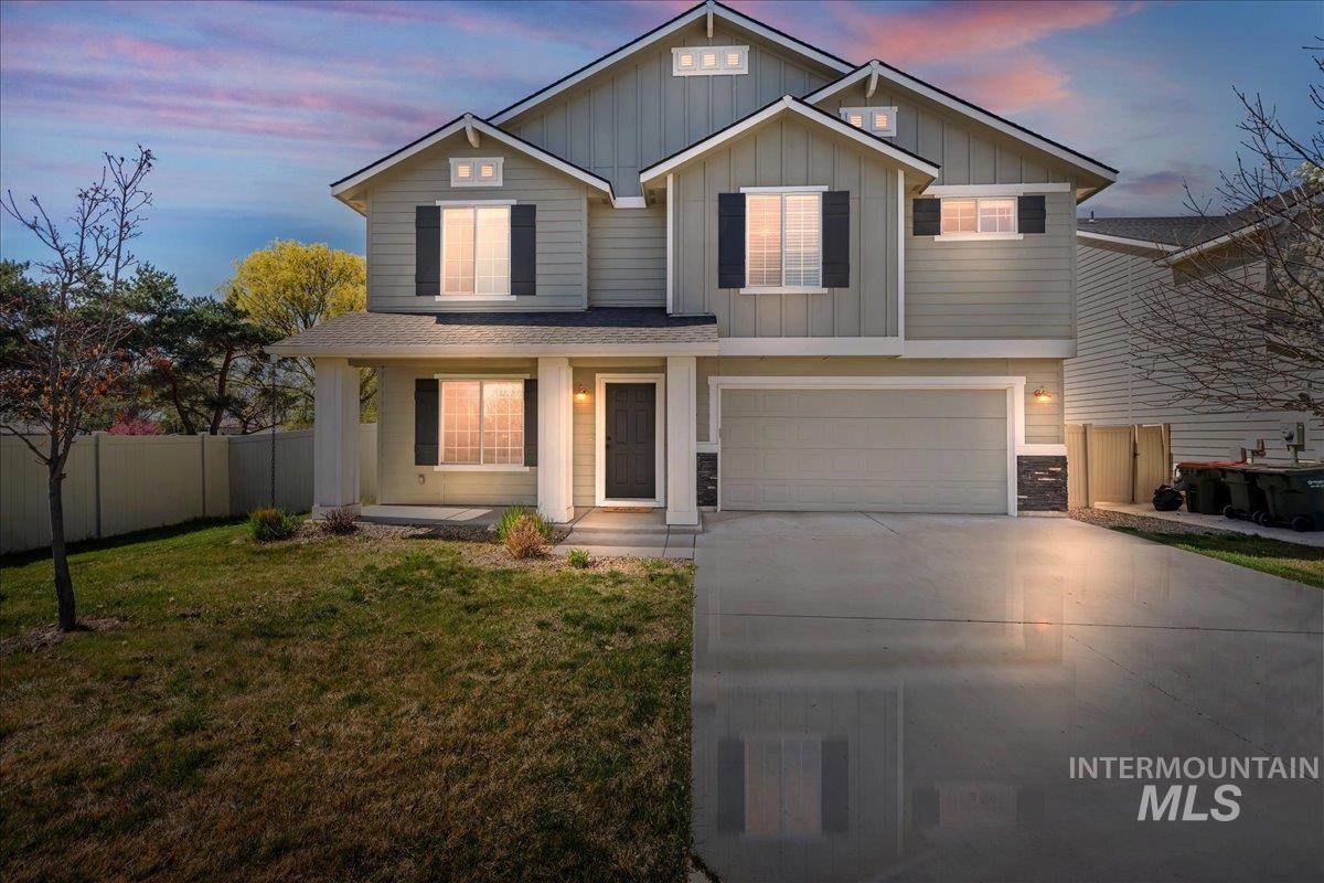 777 South Flintstone Avenue Meridian, ID 83642 - Photo 1 of 38 View of front of house featuring covered porch, board and batten siding, an attached garage, and concrete driveway
