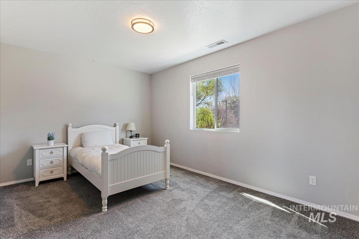 777 South Flintstone Avenue Meridian, ID 83642 - Photo 18 of 38 Bedroom featuring carpet and baseboards