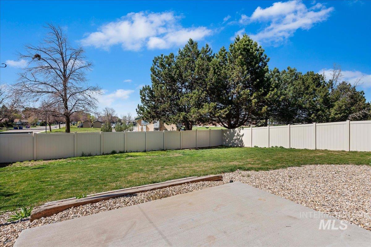 777 South Flintstone Avenue Meridian, ID 83642 - Photo 34 of 38 Fenced backyard with a patio