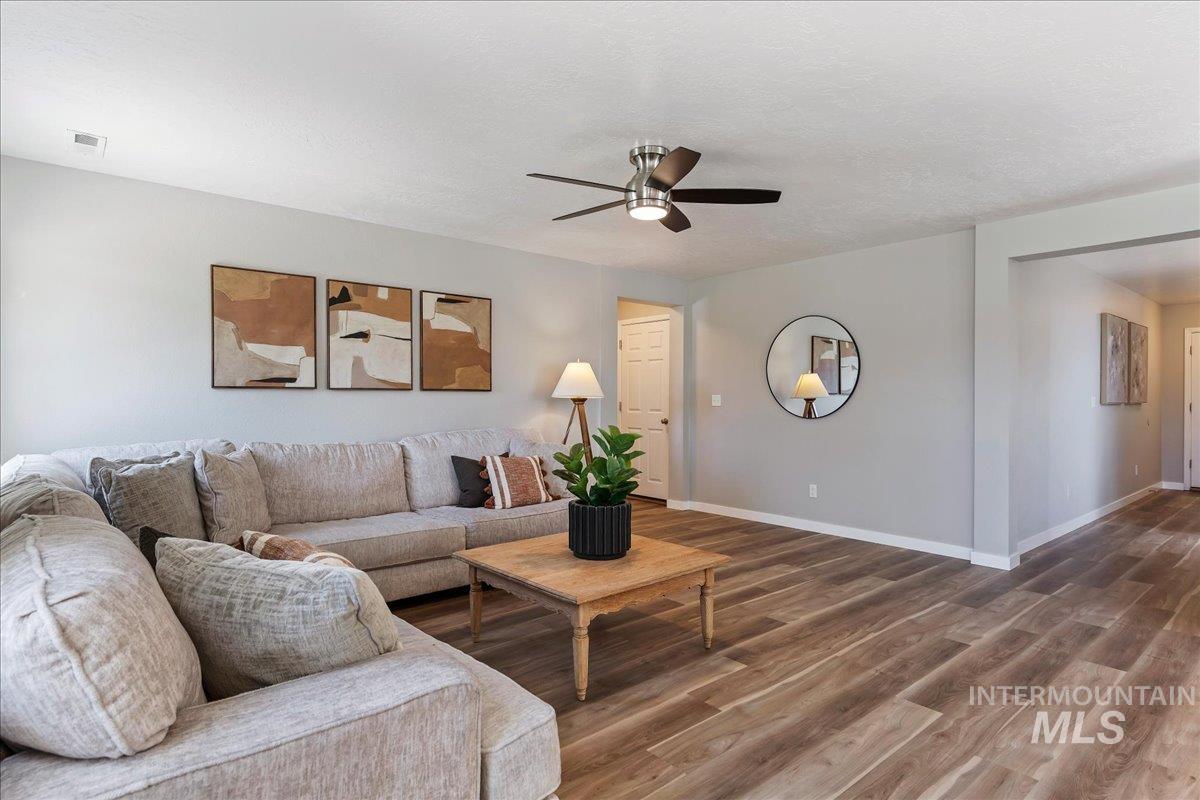 777 South Flintstone Avenue Meridian, ID 83642 - Photo 8 of 38 Living area with wood finished floors and a ceiling fan