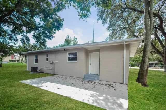 a backyard of a house with lots of green space