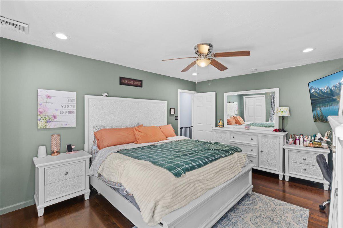 3 Cross Road Pine Hill, NJ 08021 - Photo 12 of 24 a bedroom with a bed and a chandelier