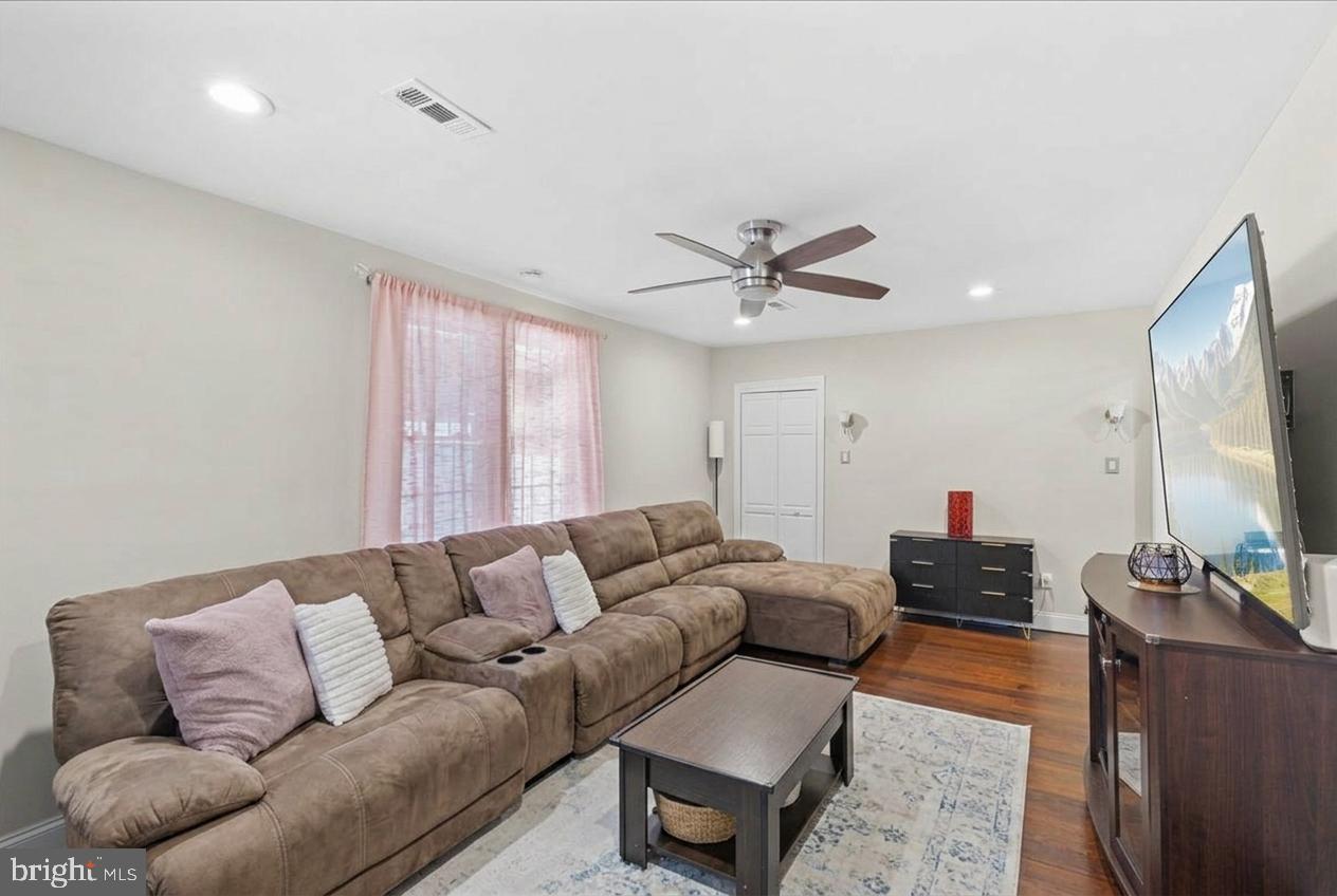 3 Cross Road Pine Hill, NJ 08021 - Photo 6 of 24 a living room with furniture and a flat screen tv