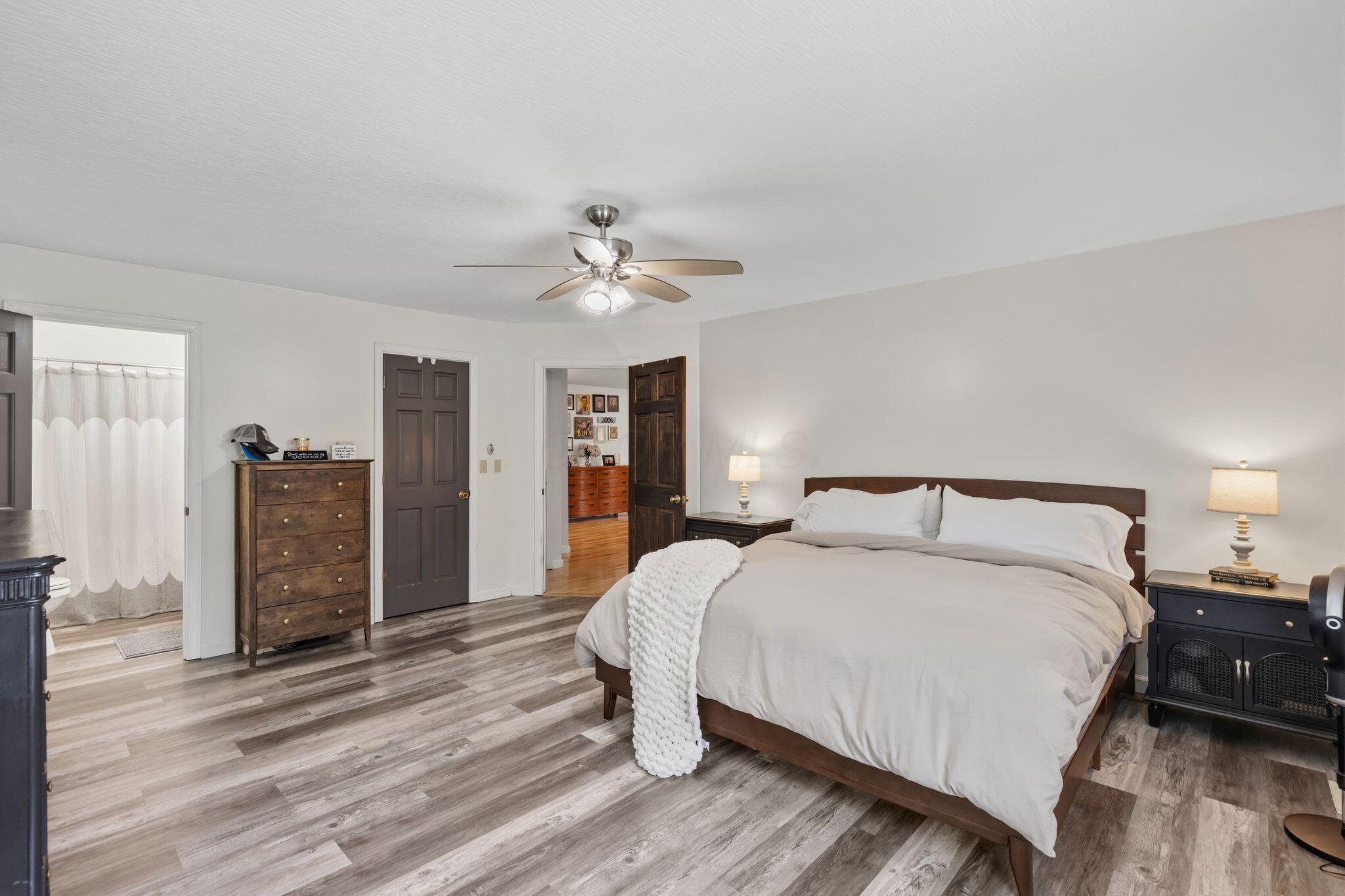 10446 Rich Hollow Road Southwest Lancaster, OH 43130 - Photo 47 of 83 Spacious room featuring wood-finish flooring, white walls, and a ceiling fan with integrated lighting