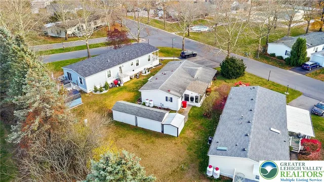 an aerial view of a house with a swimming pool