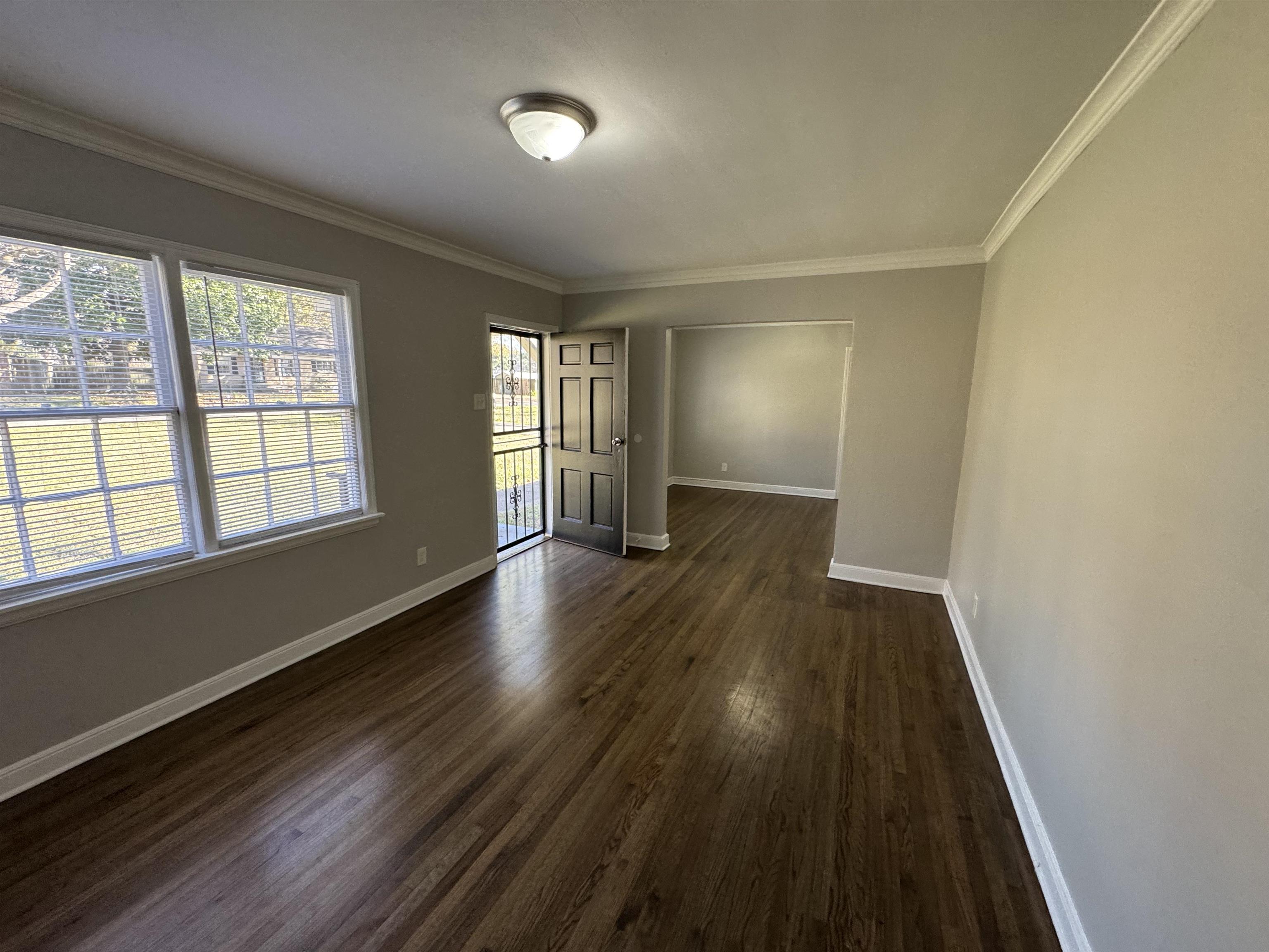 4125 Michael Road Memphis, TN 38116 - Photo 11 of 11 an empty room with wooden floor and windows