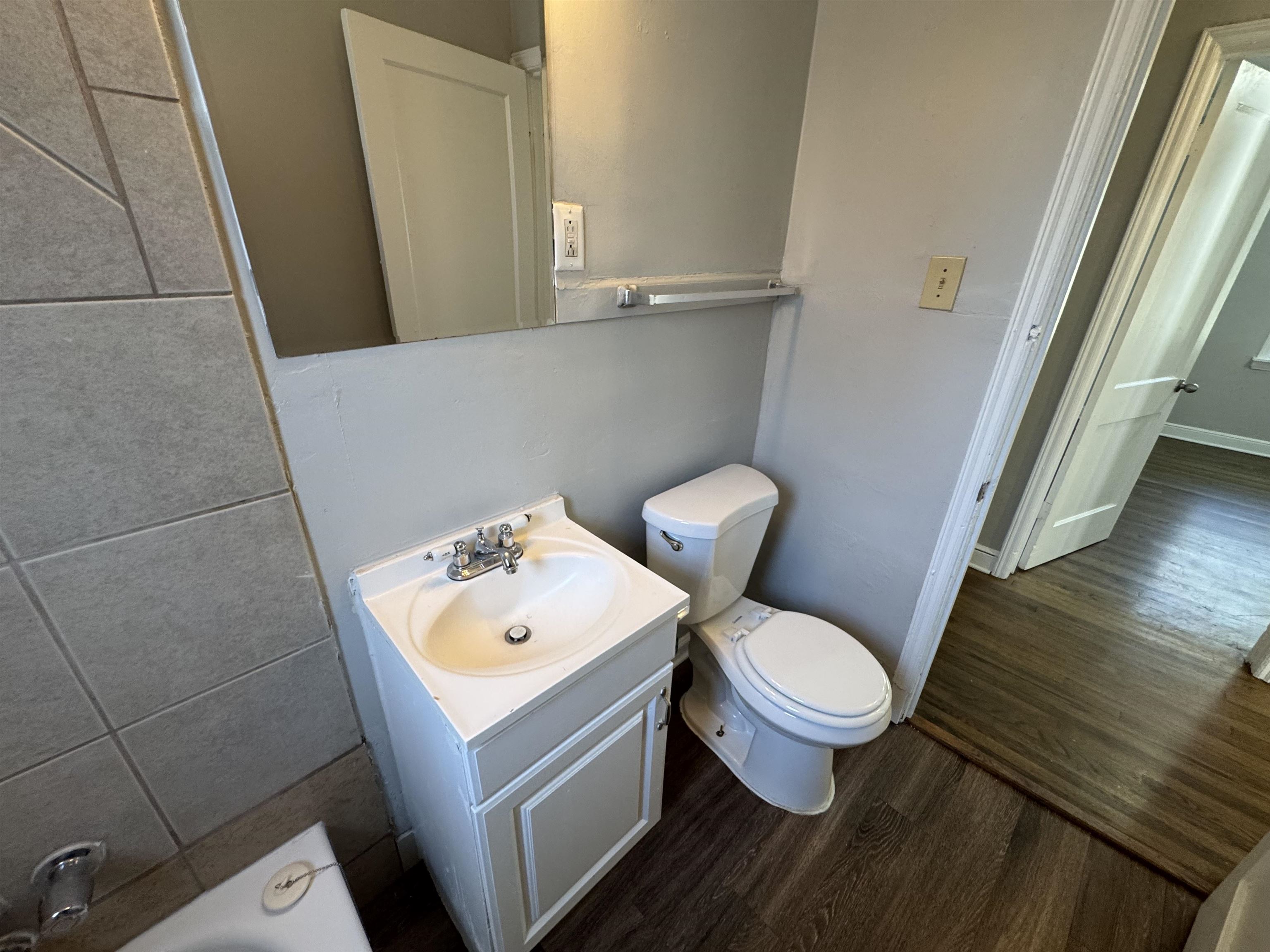 4125 Michael Road Memphis, TN 38116 - Photo 8 of 11 a bathroom with a toilet sink and mirror