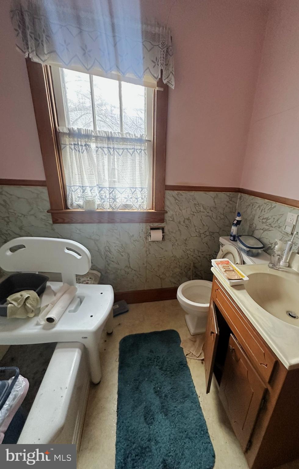 919 York Street Hanover, PA 17331 - Photo 18 of 24 a bathroom with a sink toilet and mirror