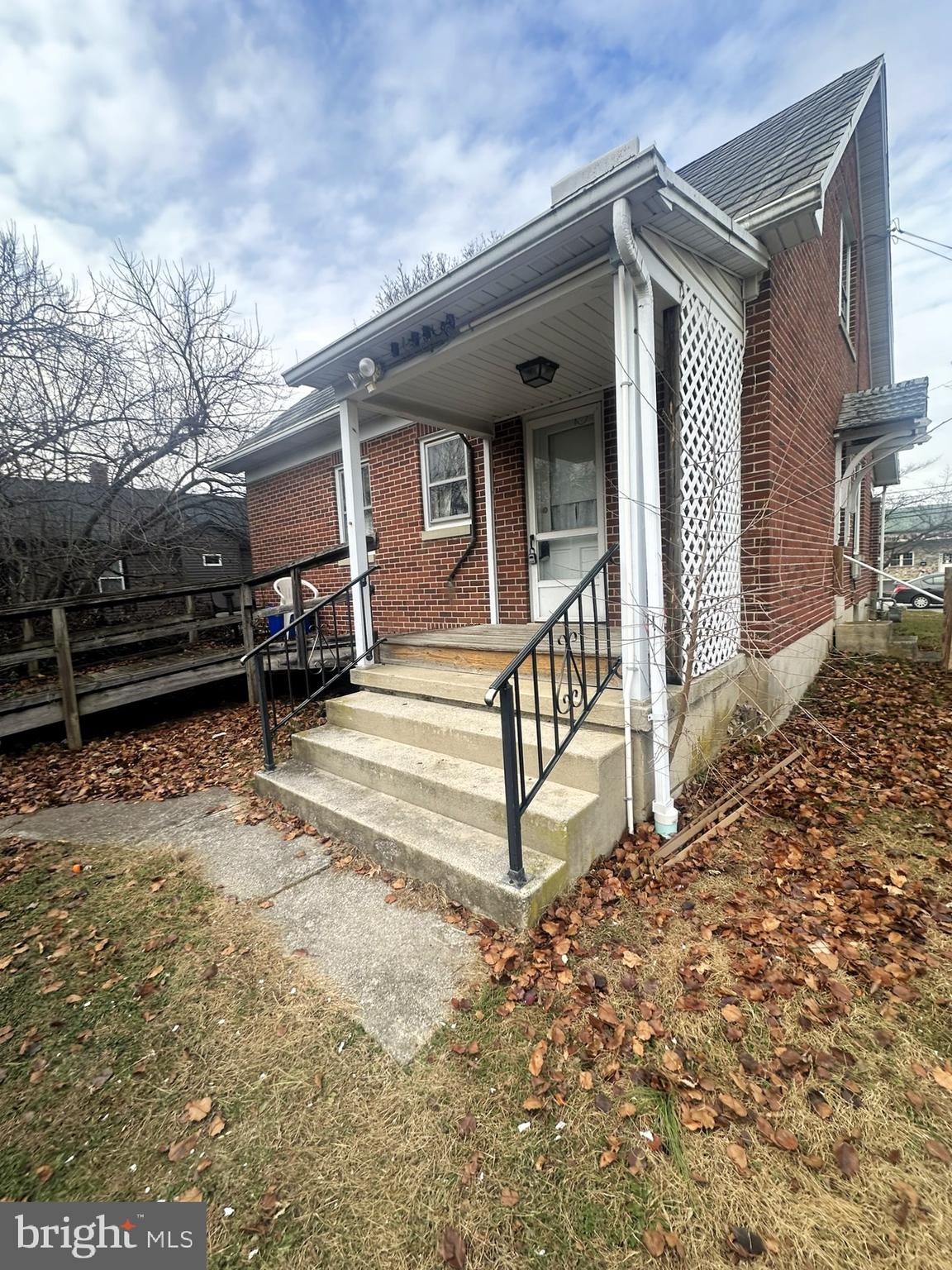 919 York Street Hanover, PA 17331 - Photo 6 of 24 a view of a house with a large window and wooden fence
