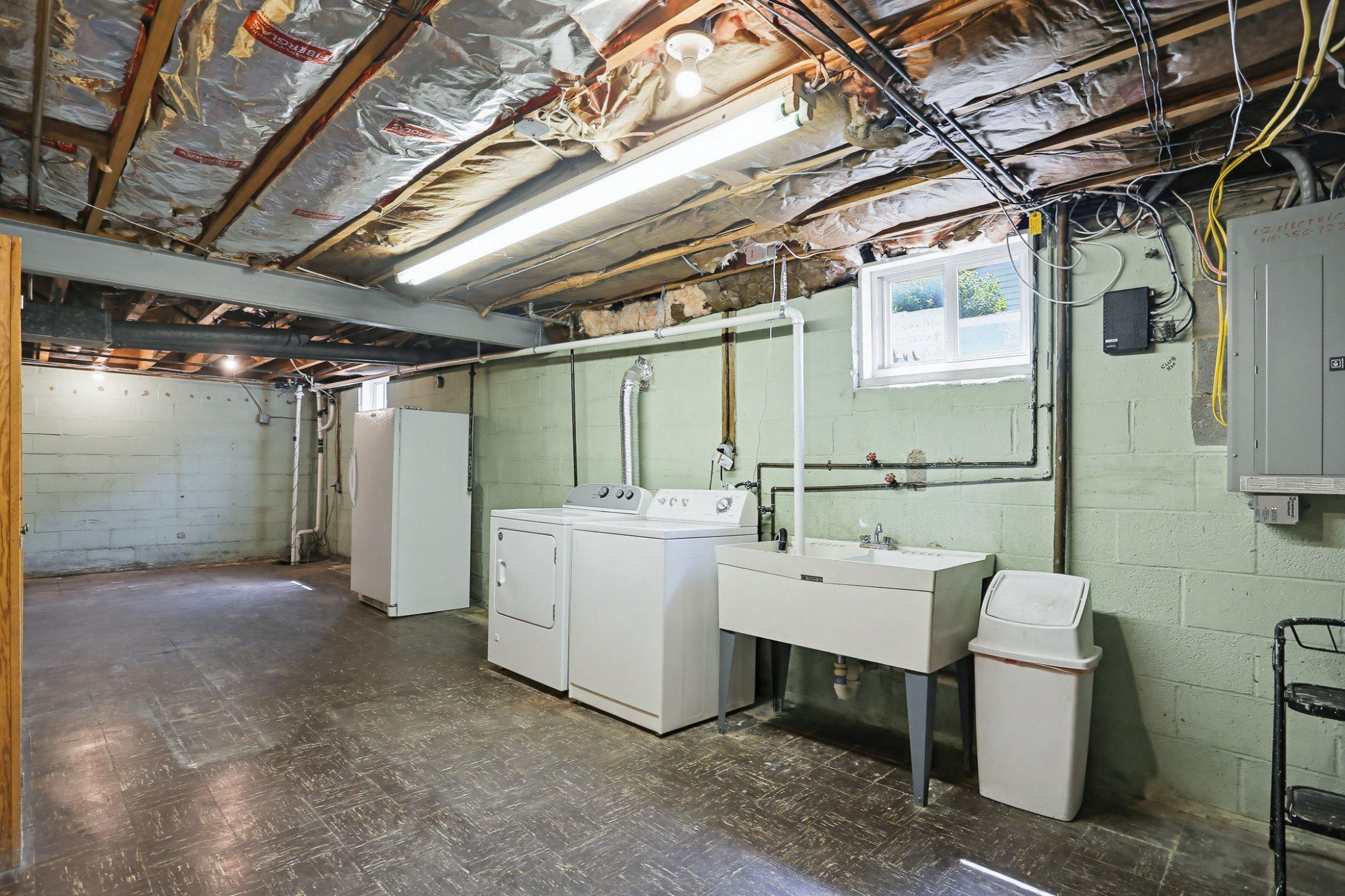 8145 Scotts Level Road Pikesville, MD 21208 - Photo 33 of 45 Large laundry area with washer and dryer.