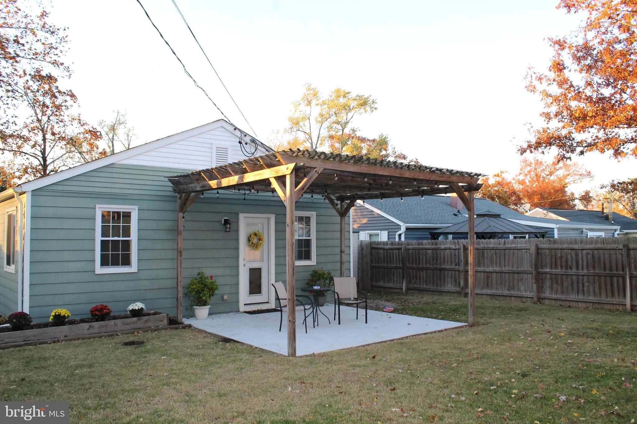 1613 Kimber Road Glen Burnie, MD 21060 - Photo 29 of 39 a view of a house with a patio