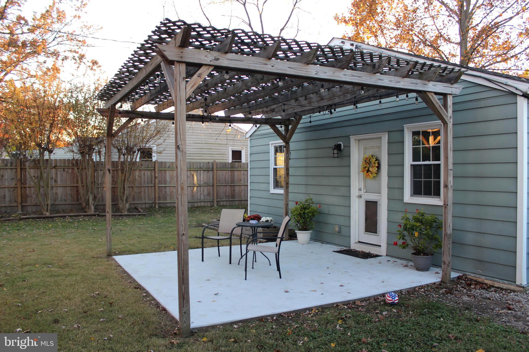 1613 Kimber Road Glen Burnie, MD 21060 - Photo 30 of 39 a view of a patio with a table and chairs