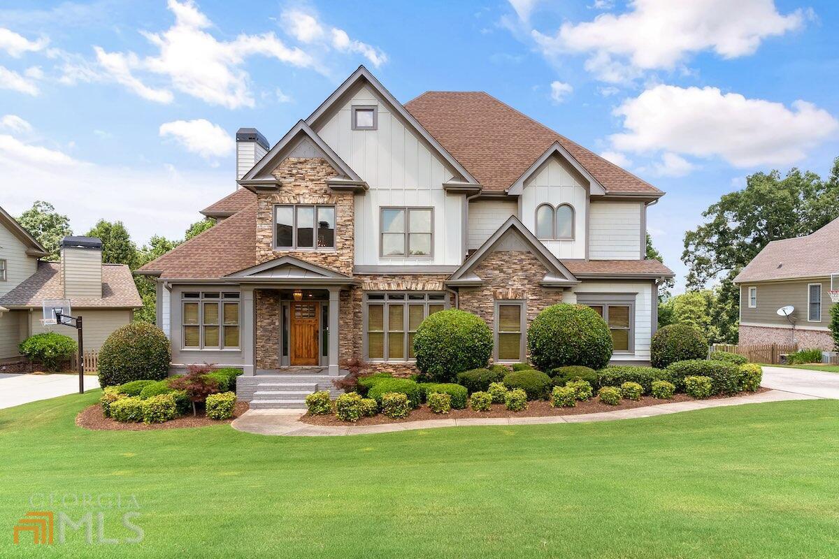 3555 Horizon Court Cumming, GA 30041 - Photo 1 of 1 a front view of a house with a garden and plants