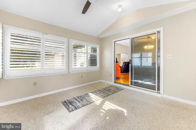 a view of an empty room with glass door