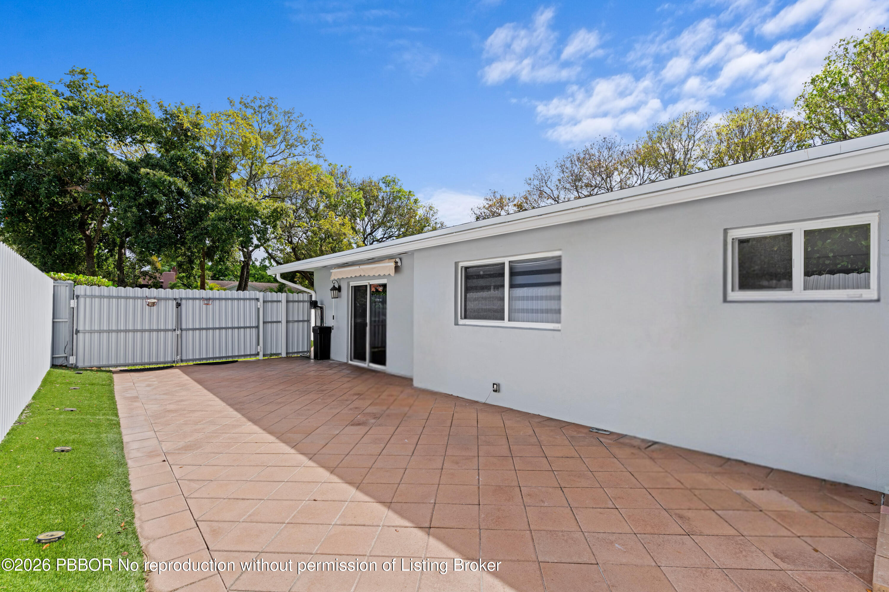 747 Avon Road West Palm Beach, FL 33401 - Photo 21 of 29 a backyard of a house with lots of green space