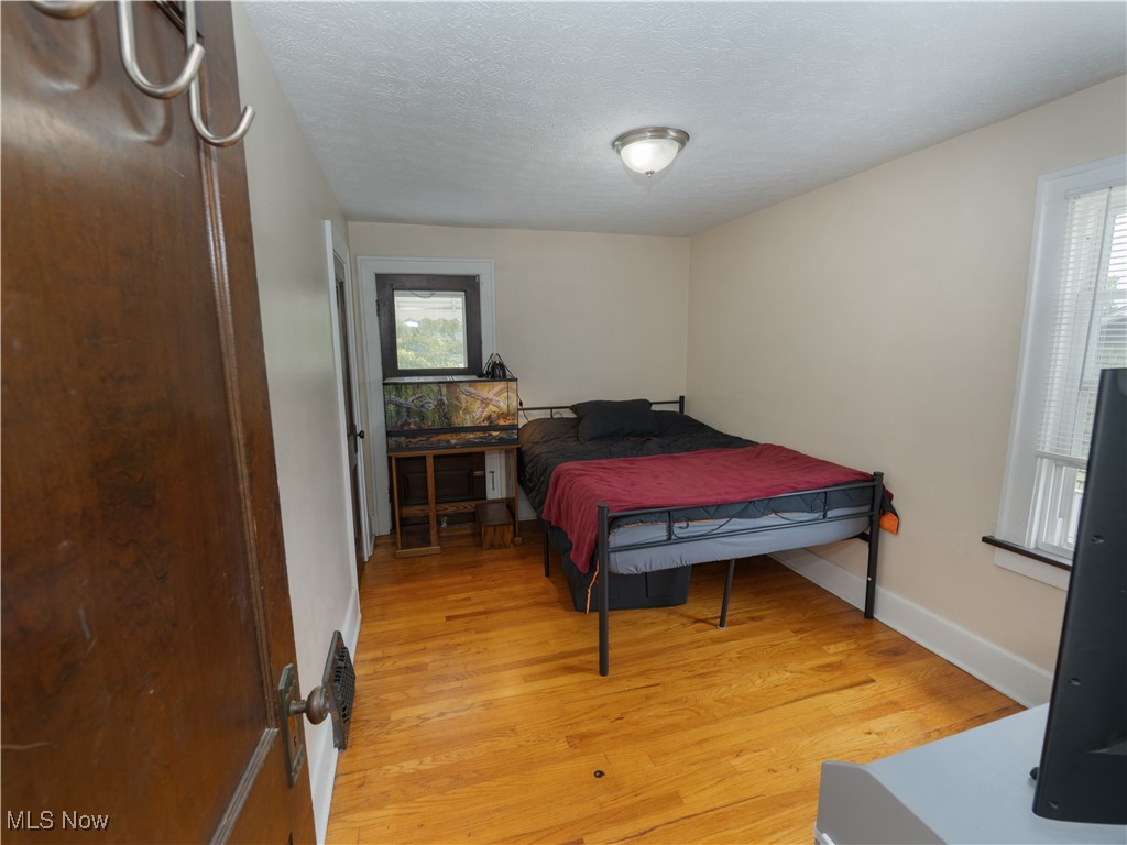 6021 Snow Road Parma, OH 44129 - Photo 11 of 28 Upstairs bedroom with wood flooring