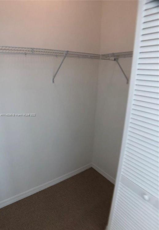 950 Brickell Bay Drive, Unit 602 Miami, FL 33131 - Photo 14 of 20 a view of small space with racks on the wall