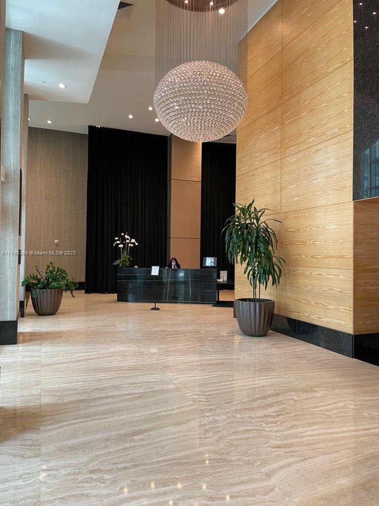 950 Brickell Bay Drive, Unit 602 Miami, FL 33131 - Photo 3 of 20 a view of a house with potted plants