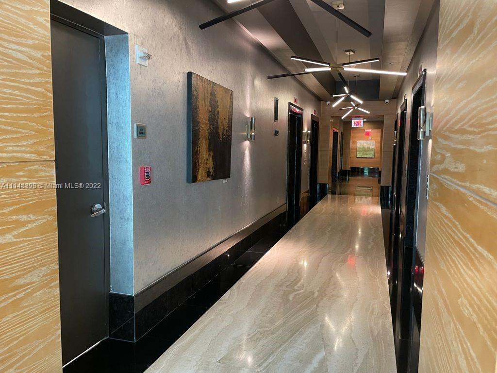 950 Brickell Bay Drive, Unit 602 Miami, FL 33131 - Photo 5 of 20 a view of hallway