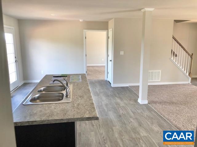 197 Riva Way Palmyra, VA 22963 - Photo 12 of 33 a room with a sink and a wooden floor