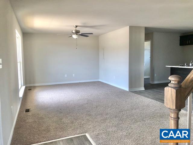 197 Riva Way Palmyra, VA 22963 - Photo 6 of 33 an empty room with a ceiling fan and window