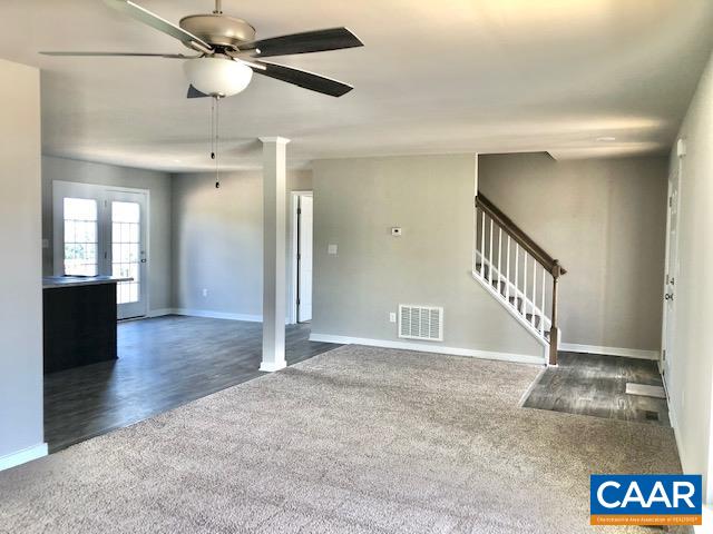 197 Riva Way Palmyra, VA 22963 - Photo 7 of 33 en view interior of a house with wooden floor a ceiling fan and windows
