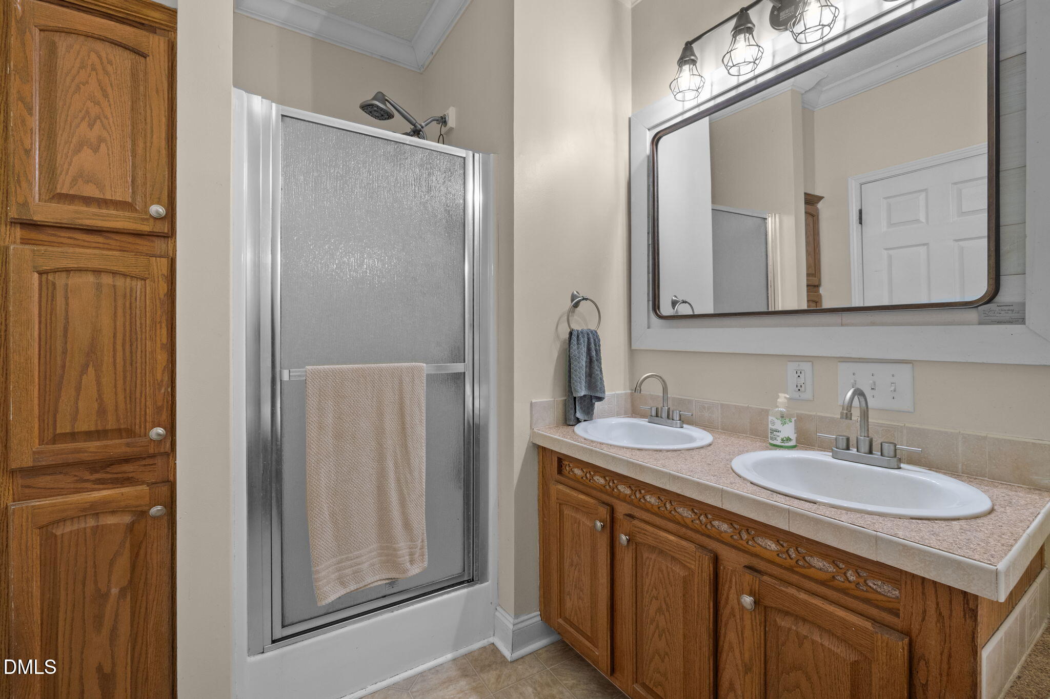 129 Family Drive Rougemont, NC 27572 - Photo 16 of 37 a bathroom with a sink double vanity and a mirror