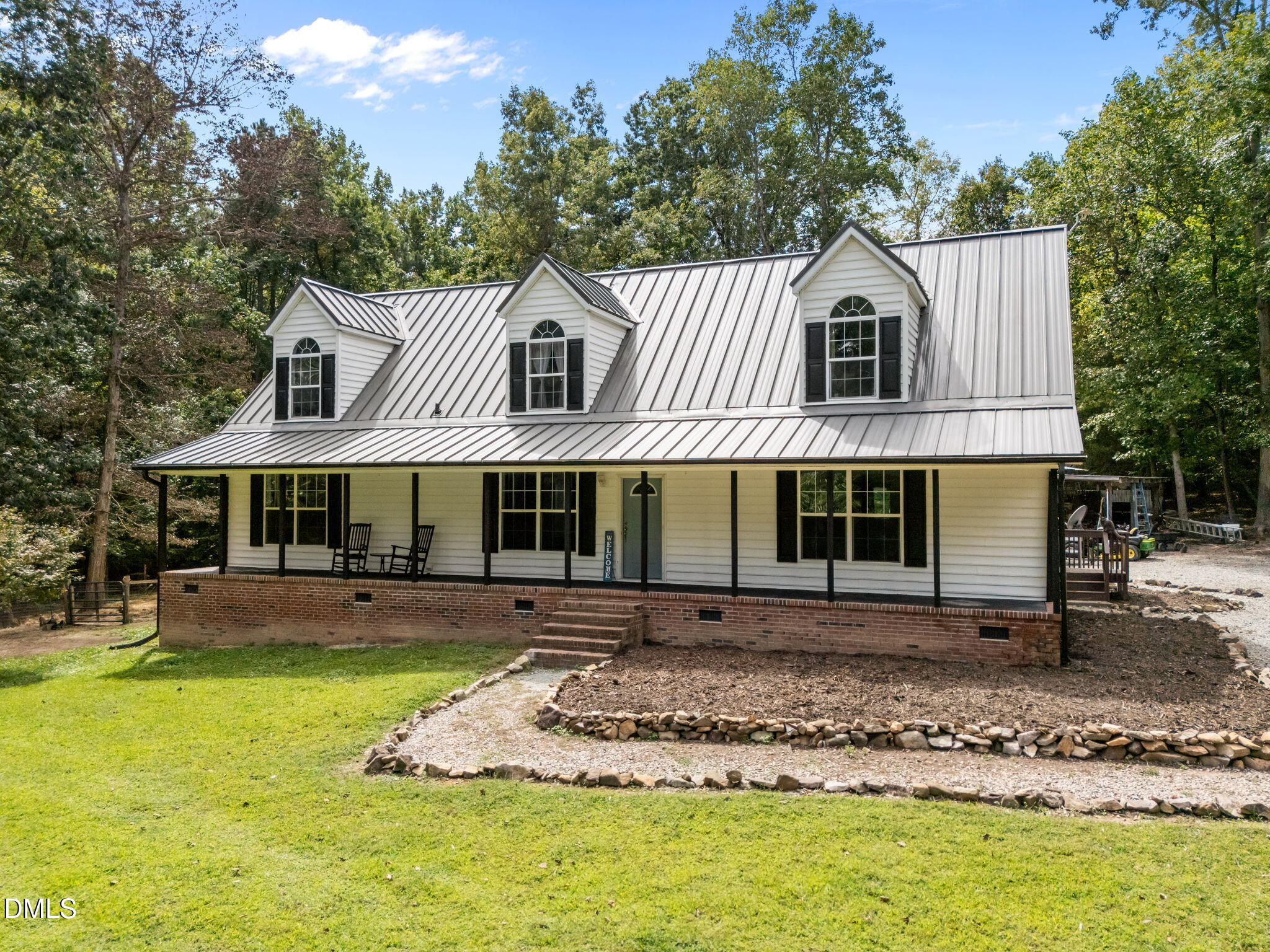 129 Family Drive Rougemont, NC 27572 - Photo 2 of 37 a front view of a house with a yard